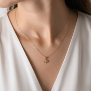 Woman wearing 14ct Gold Scottish Jewellery Small Thistle Pendant by Kolié Fine Jewellery