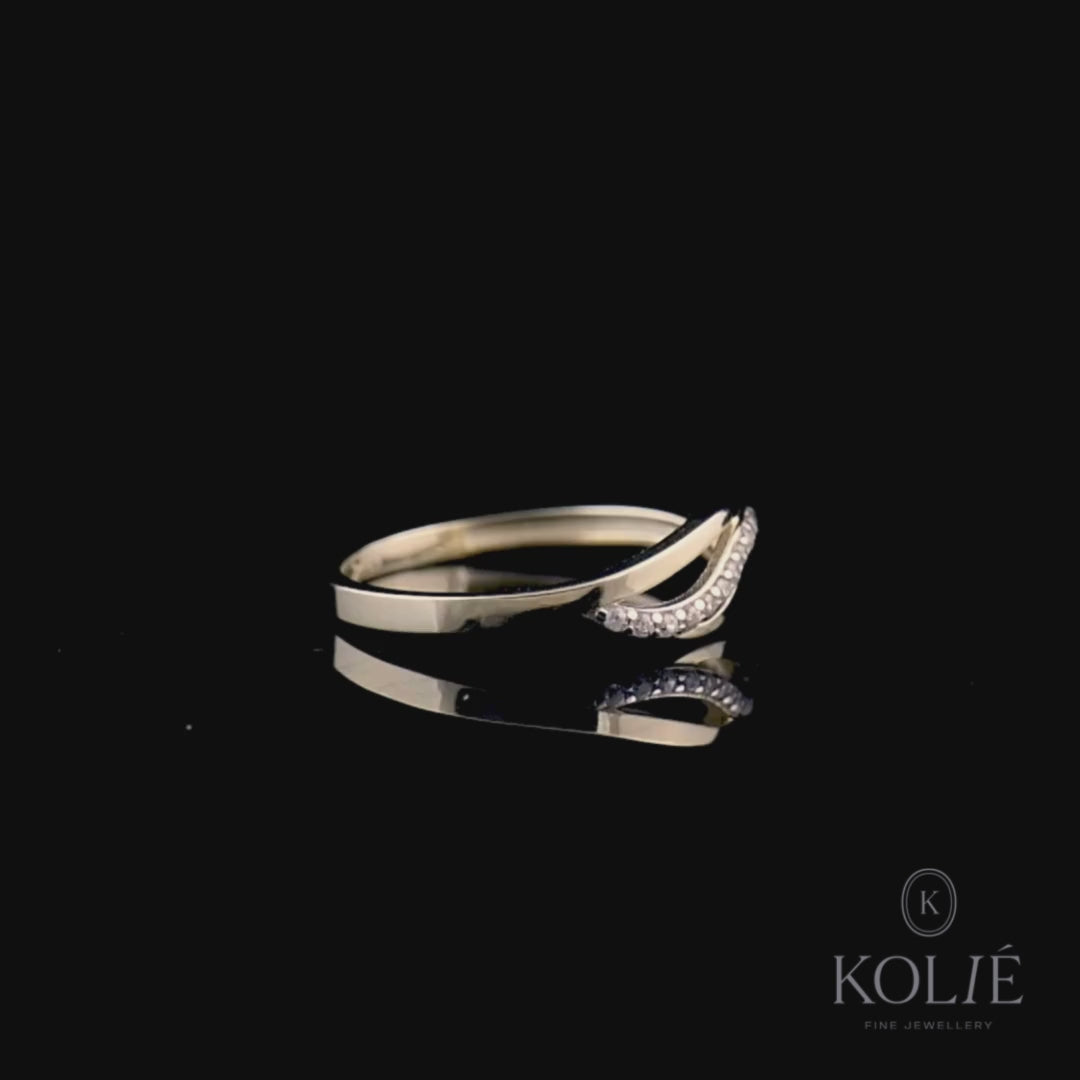 Stylish Kolié 9ct yellow gold ring showcasing a crossover design with a band of shimmering cubic zirconia