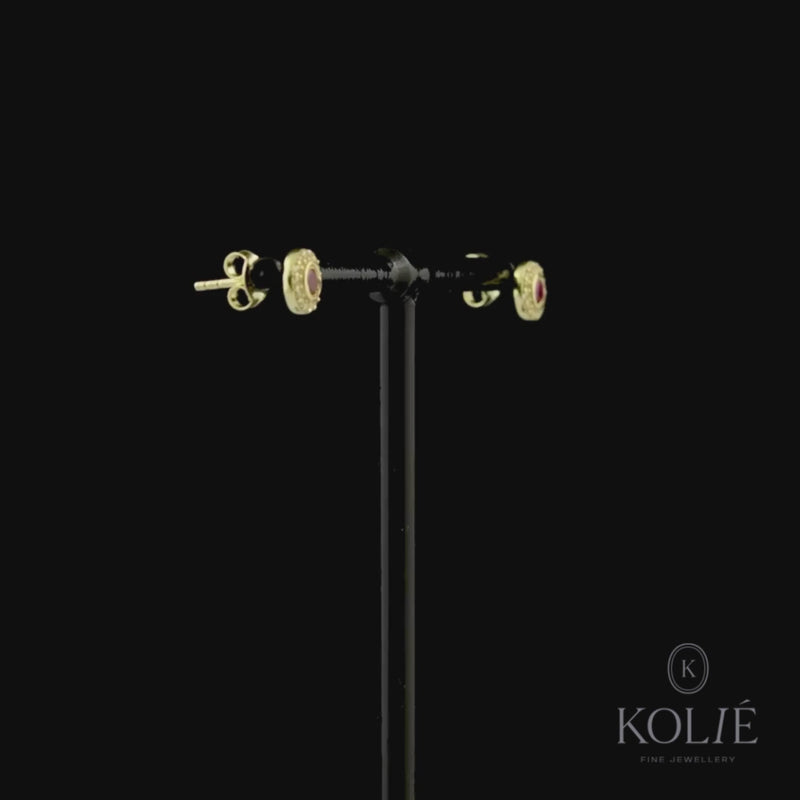 Kolié 9ct yellow gold stud earrings with central pink zirconia and clear zirconia halo, perfect for adding elegance to any outfit.