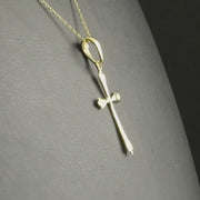 14ct gold cross pendant to show its size and delicate design