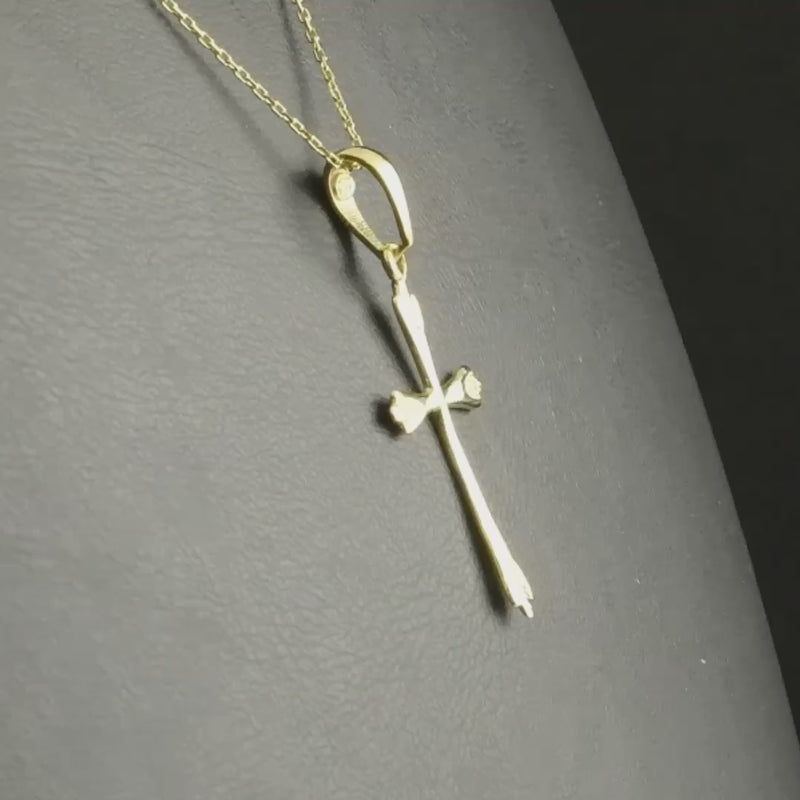 14ct gold cross pendant to show its size and delicate design