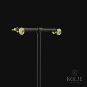 Kolié 9ct yellow gold earrings featuring a green cubic zirconia center surrounded by a clear zirconia halo for an elegant, vibrant look.