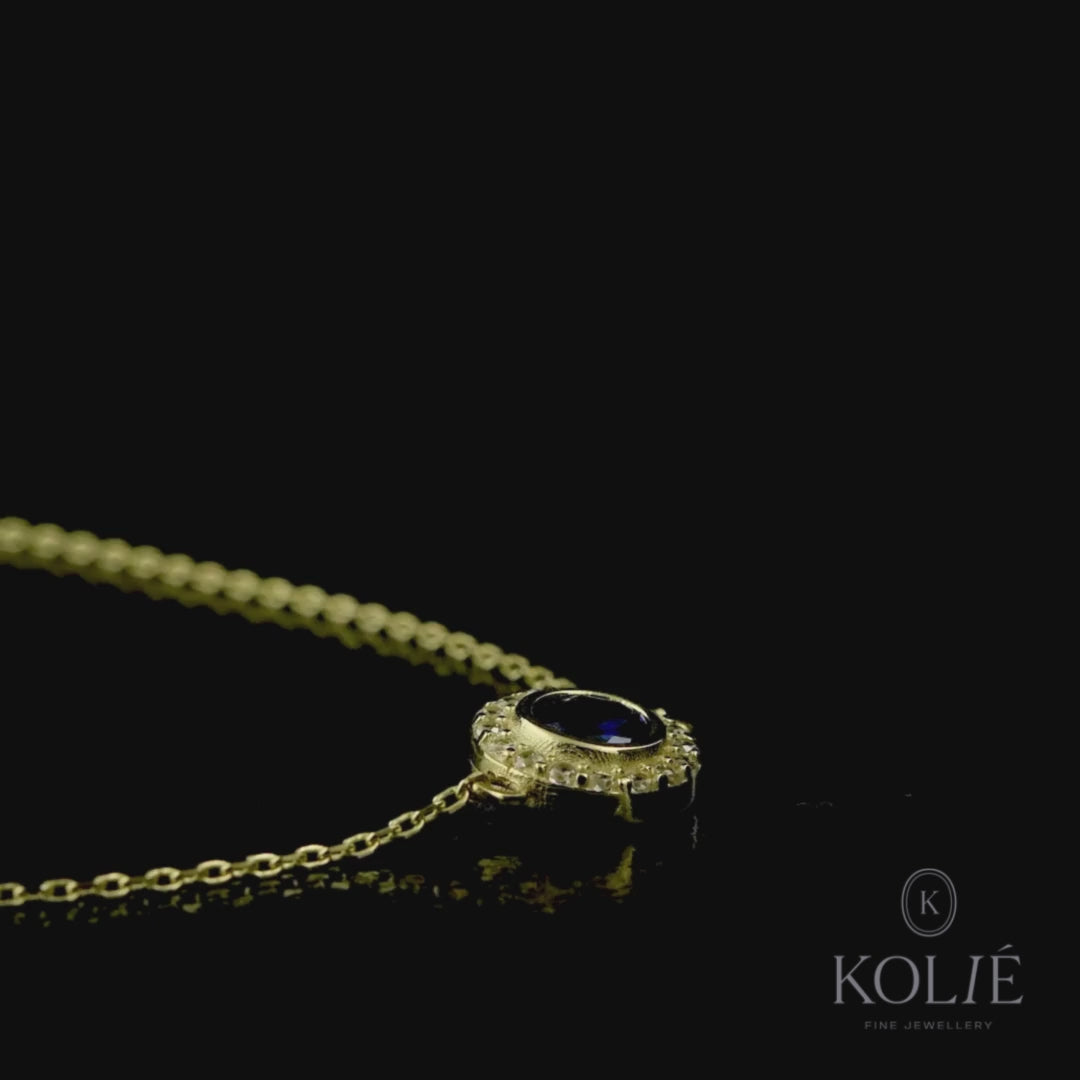 Kolié 9ct yellow gold bracelet with a sapphire blue cubic zirconia centerpiece on a fine chain for an elegant addition to any wardrobe.
