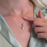 Video of the pendant displayed on a delicate gold chain on a model