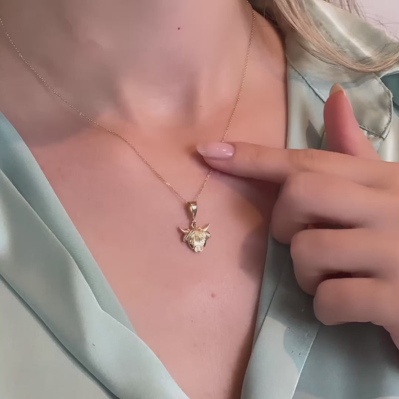 Video of the pendant displayed on a delicate gold chain on a model