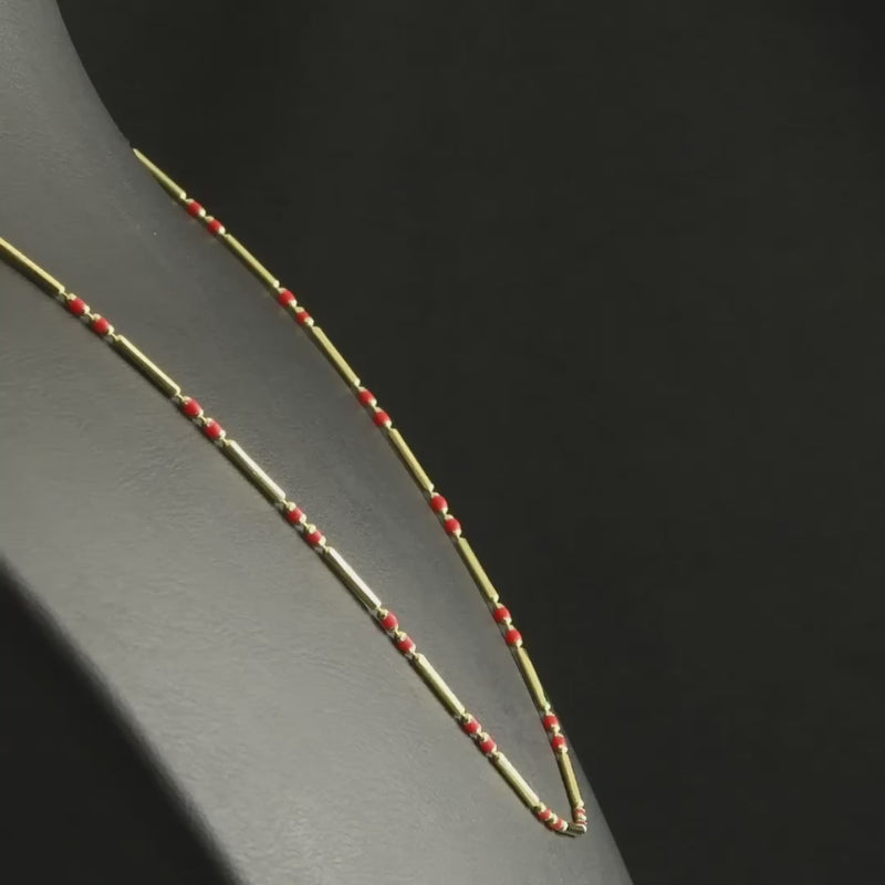 Video of elegant 14ct gold beaded necklace with red gemstones, lightweight and sophisticated.