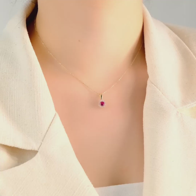 Video of model wearing the 14ct gold halo CZ ruby pendant to showcase its size and fit.