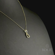 Kolié 9ct yellow gold open heart pendant with a cubic zirconia border