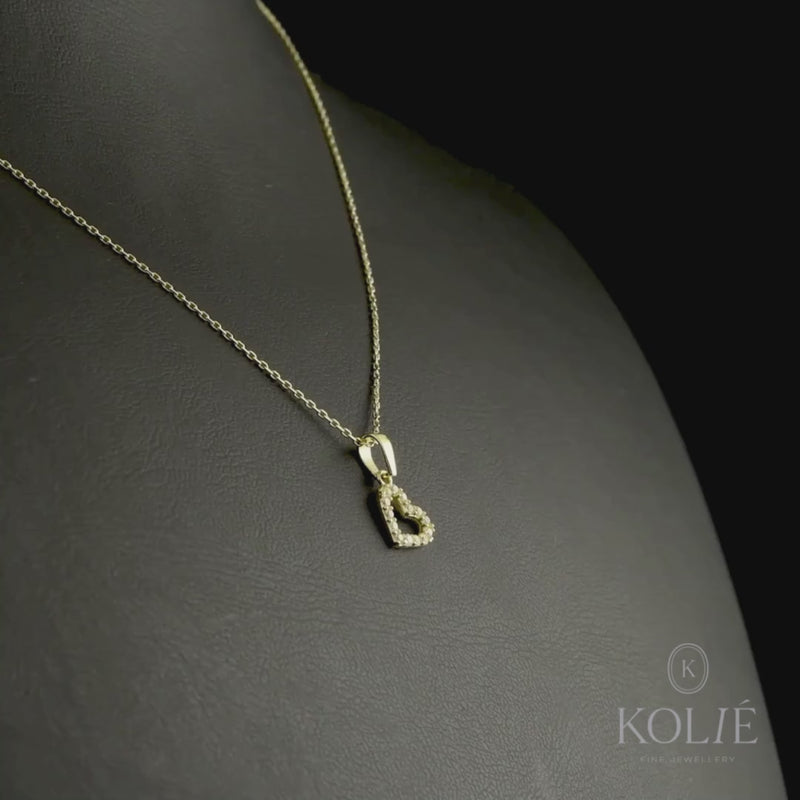 Kolié 9ct yellow gold open heart pendant with a cubic zirconia border