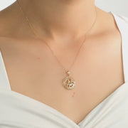 Video of the pendant displayed on a model, showcasing the hallmarked back.
