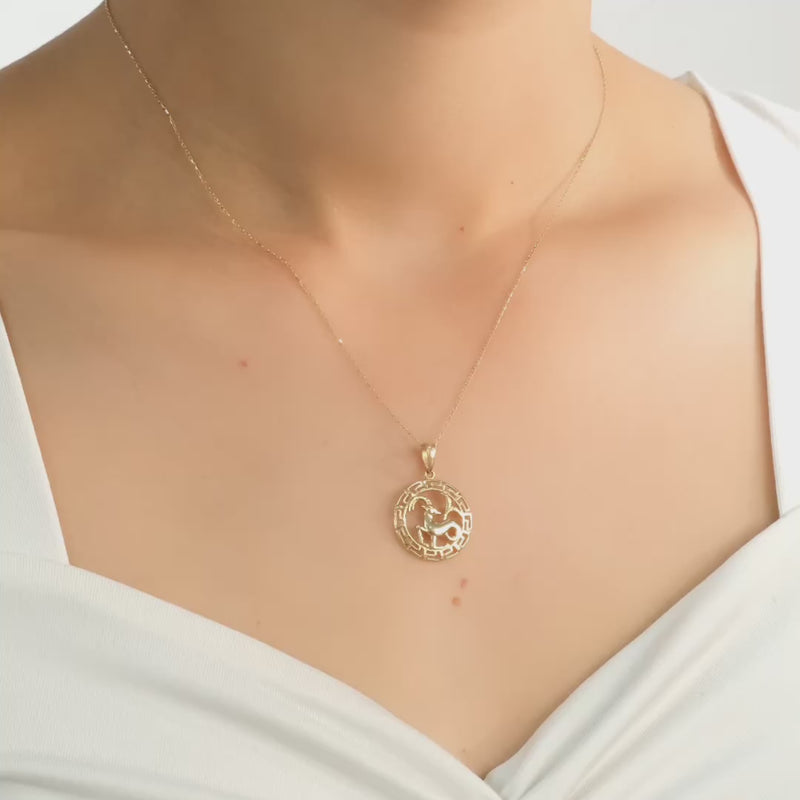 Video of the pendant displayed on a model, showcasing the hallmarked back.
